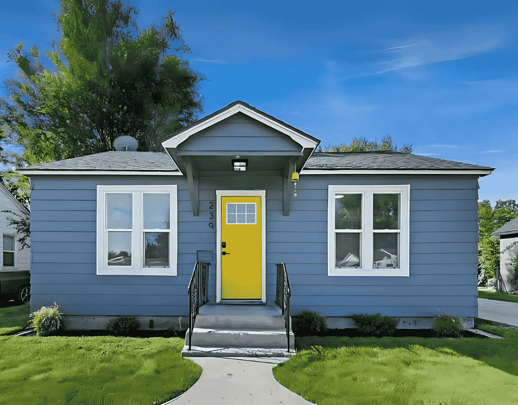 Vibrant blue house with yellow door painted by 1st Choice Painting LLC in Boise ID
